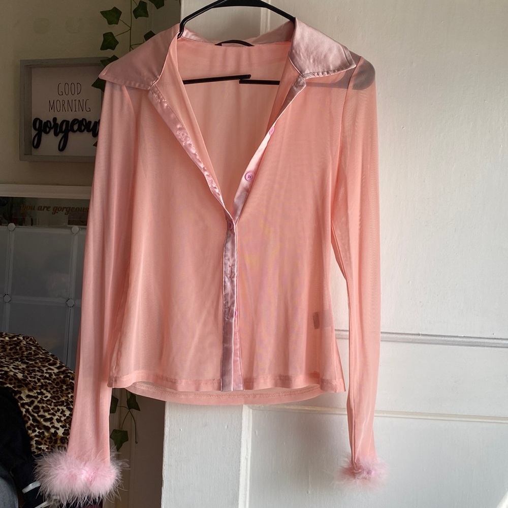 Pink blouse with feathered cuffs